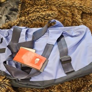 The North Face Blue and Gray Duffel Bag with Durable Design